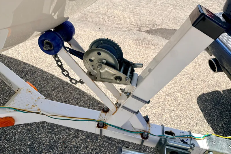 Slide: The Image of Trailer winch mechanism for 2004 Bombardier SEADOO Utopia 185 boat, featuring blue rollers. - 53