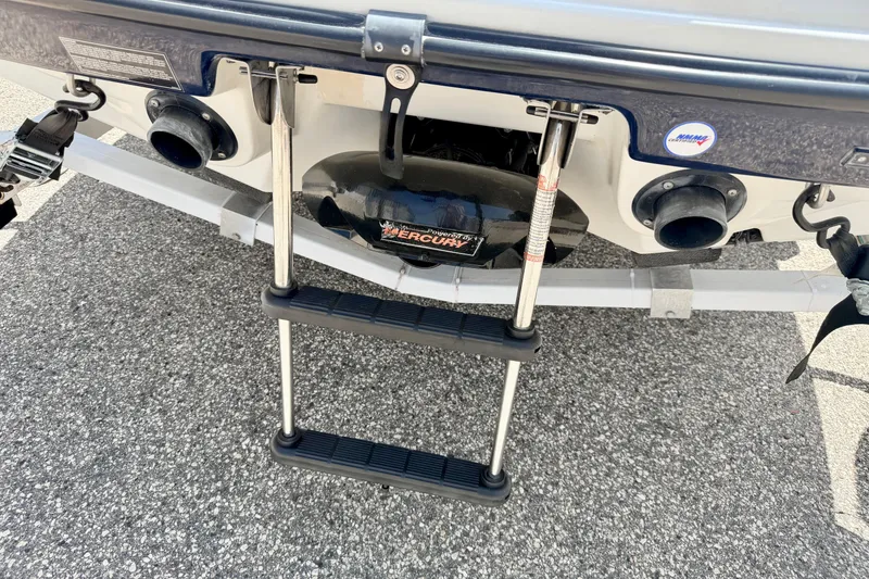Slide: The Image of Rear view of a 2004 Bombardier SEADOO Utopia 185 with a ladder and Mercury engine. - 46