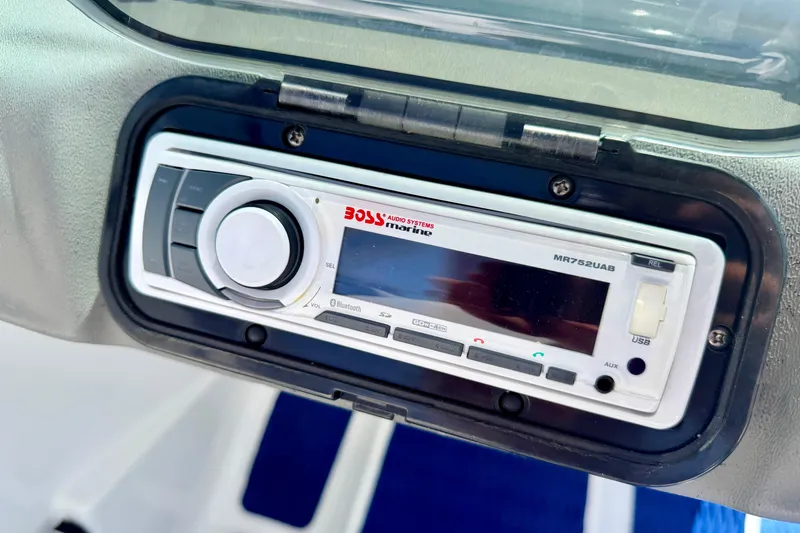 Slide: The Image of Marine stereo system on a 2004 Bombardier SEADOO Utopia 185 boat dashboard. - 27