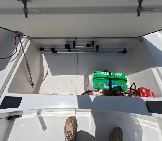 Slide: The Image of Storage area in Mako Pro Skiff 15 CC with battery and rod holders. - 21