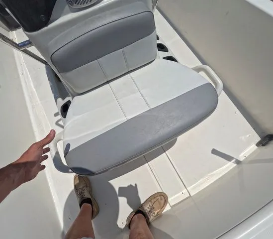 Slide: The Image of Close-up of a white and gray seat on a Mako Pro Skiff 15 CC boat. - 17