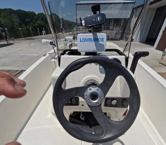 Slide: The Image of The image shows the helm of a Mako Pro Skiff 15 CC with a Lowrance device. - 15