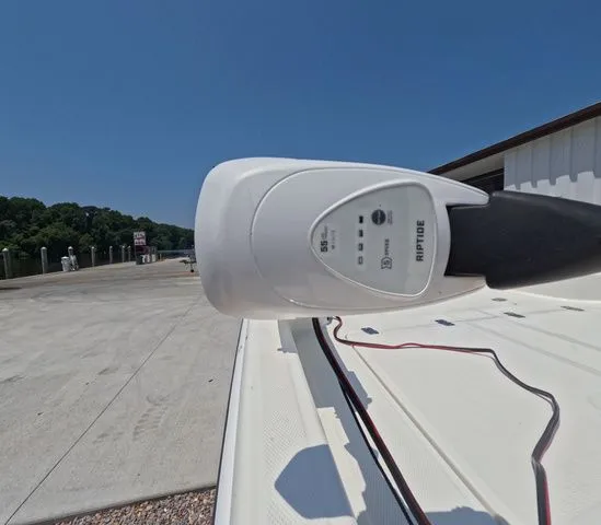 Slide: The Image of Close-up of a boat motor on a Mako Pro Skiff 15 CC. - 11