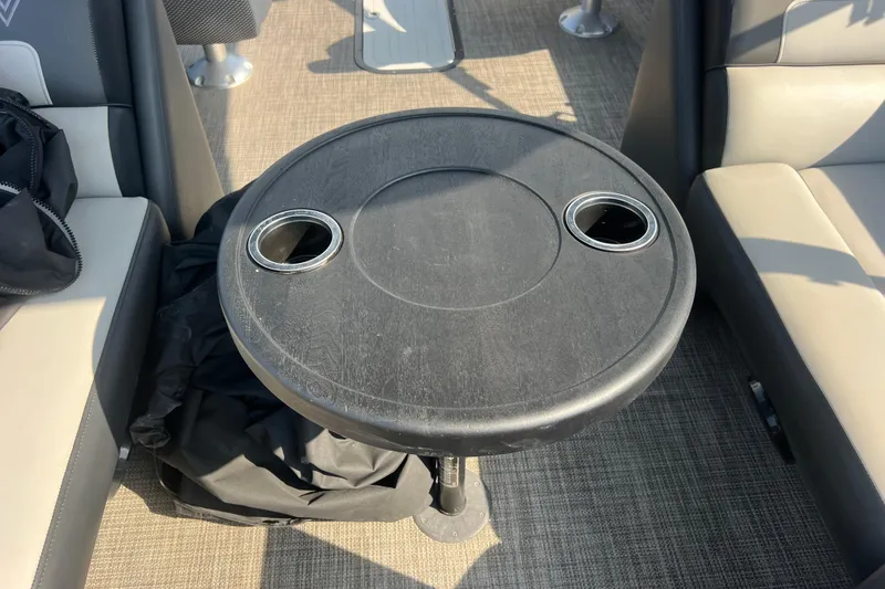 Slide: The Image of Round table with cup holders on a 2022 Viaggio Lago V-U 22 boat. - 33