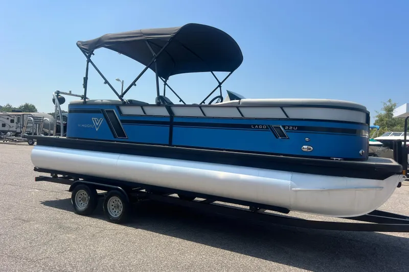 The Image of 2022 Viaggio Lago V-U 22 pontoon boat on trailer, blue and white design. - 0