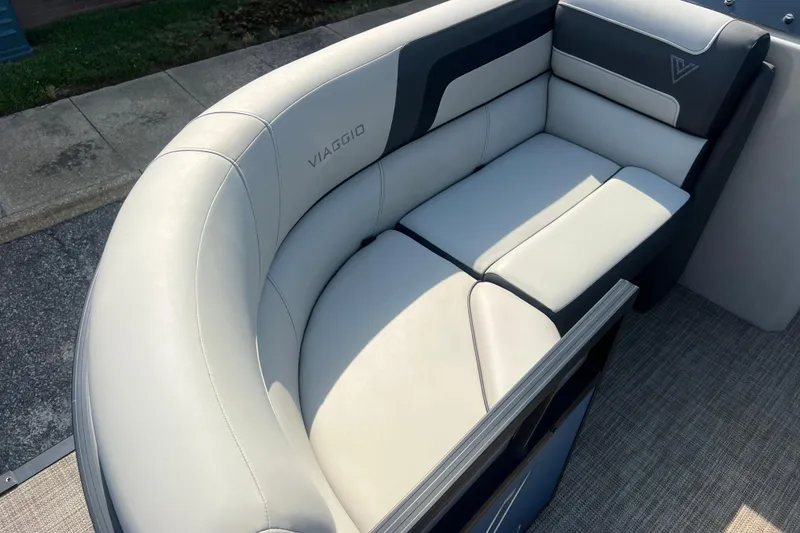 Slide: The Image of Luxurious seating on 2022 Viaggio Lago V-U 22 boat, featuring elegant white and gray upholstery. - 19