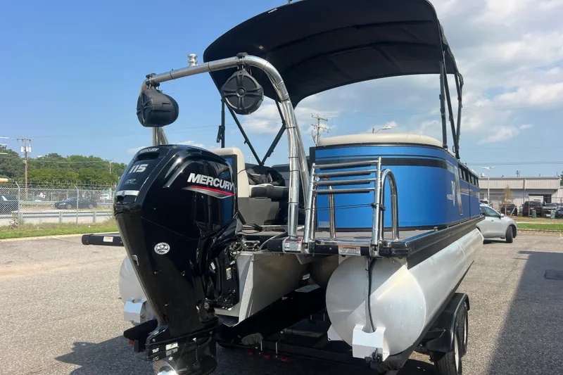 Slide: The Image of 2022 Viaggio Lago V-U 22 pontoon boat with Mercury 115 engine, parked outdoors. - 9