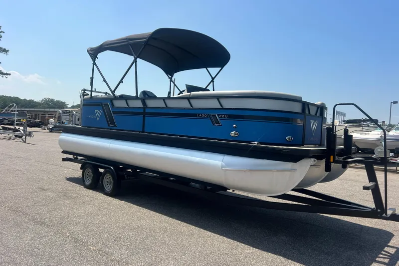 Slide: The Image of 2022 Viaggio Lago V-U 22 pontoon boat on trailer, blue and white design. - 49