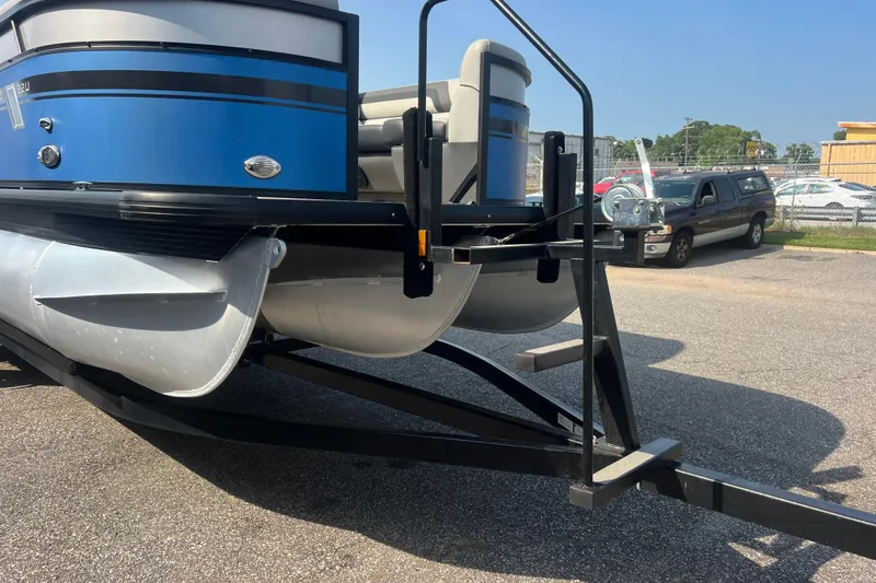 Slide: The Image of 2022 Viaggio Lago V-U 22 pontoon boat on trailer, parked outdoors. - 16
