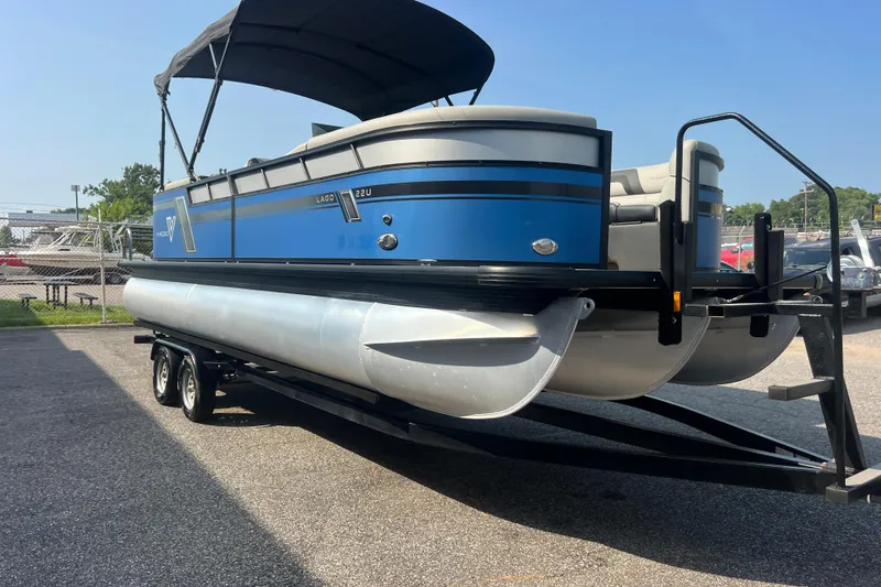 Slide: The Image of 2022 Viaggio Lago V-U 22 pontoon boat on trailer, blue and silver design. - 15