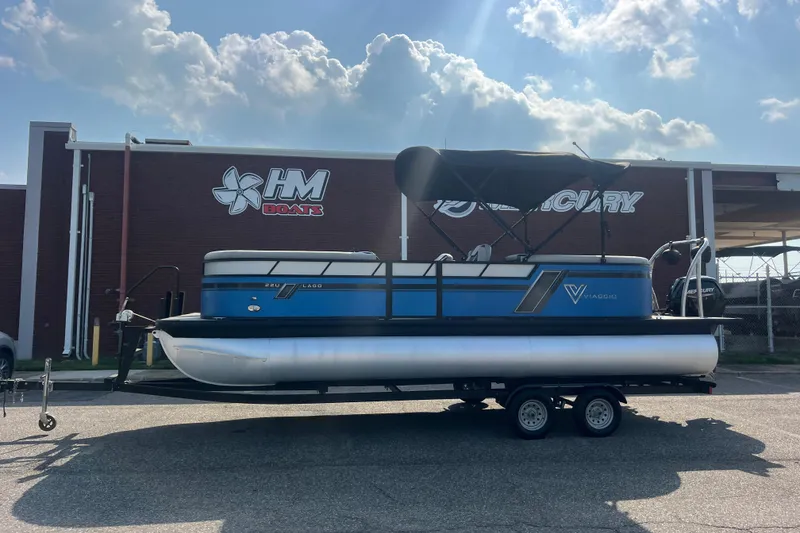 Slide: The Image of 2022 Viaggio Lago V-U 22 pontoon boat on trailer at HM Boats dealership. - 2