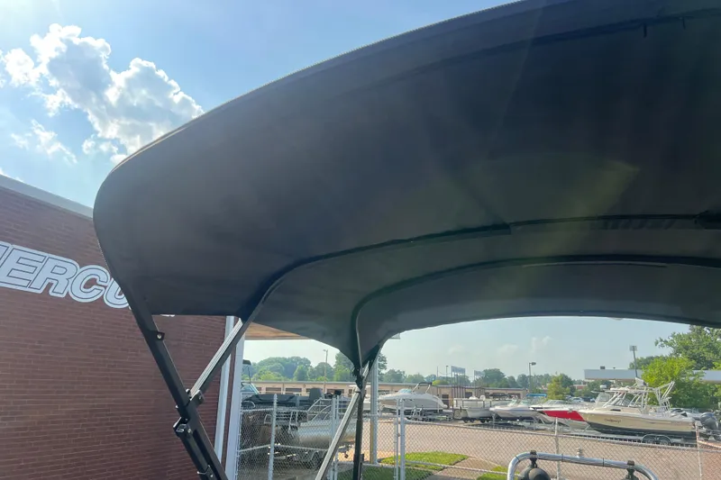 Slide: The Image of 2022 Viaggio Lago V-U 22 boat canopy under sunny sky at dealership. - 43