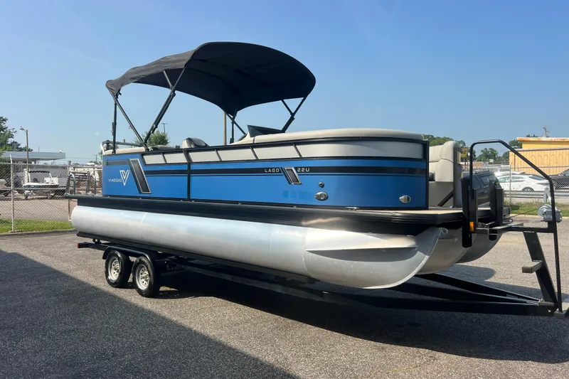 Slide: The Image of 2022 Viaggio Lago V-U 22 pontoon boat on trailer, blue and silver design. - 14
