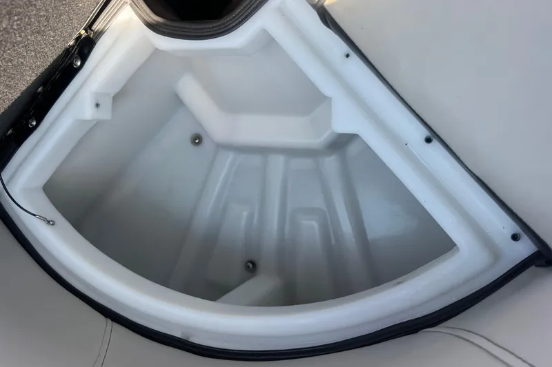 Slide: The Image of Storage compartment of 2022 Viaggio Lago V-U 22 boat, featuring a white interior. - 30