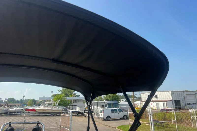 Slide: The Image of Black canopy of 2022 Viaggio Lago V-U 22 boat in a marina setting. - 44