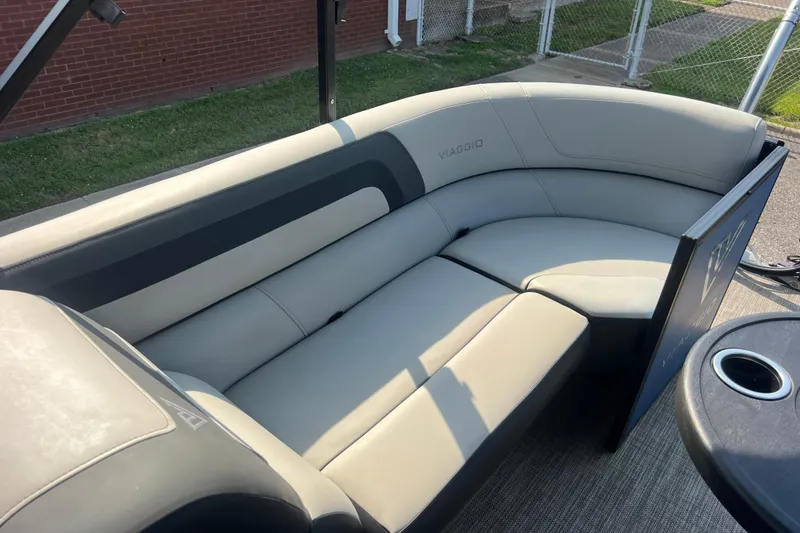 Slide: The Image of Luxurious seating on 2022 Viaggio Lago V-U 22 pontoon boat, featuring sleek gray upholstery. - 28