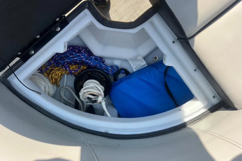 Slide: The Image of Storage compartment in a 2022 Viaggio Lago V-U 22 boat with ropes and gear. - 38