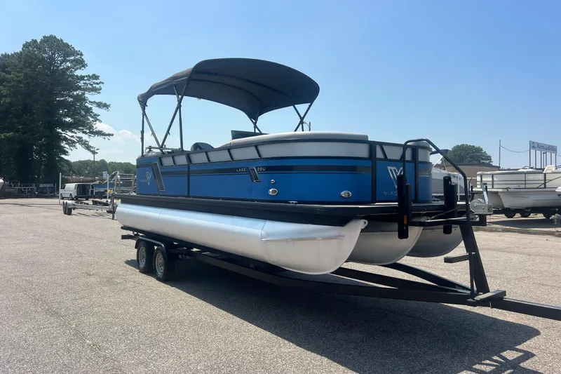 Slide: The Image of 2022 Viaggio Lago V-U 22 pontoon boat on trailer, parked outdoors. - 48