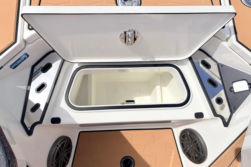 Slide: The Image of Open storage compartment on 2026 Ranger Z521R Ultra boat deck. - 31