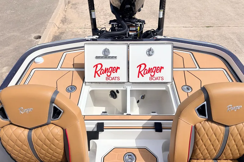 Slide: The Image of 2026 Ranger Z521R Ultra boat interior with tan seats and storage compartments. - 49