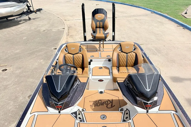 Slide: The Image of 2026 Ranger Z521R Ultra boat with tan leather seats and sleek design on display. - 32