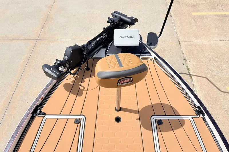 Slide: The Image of 2026 Ranger Z521R Ultra boat deck with Garmin equipment and tan seating. - 14