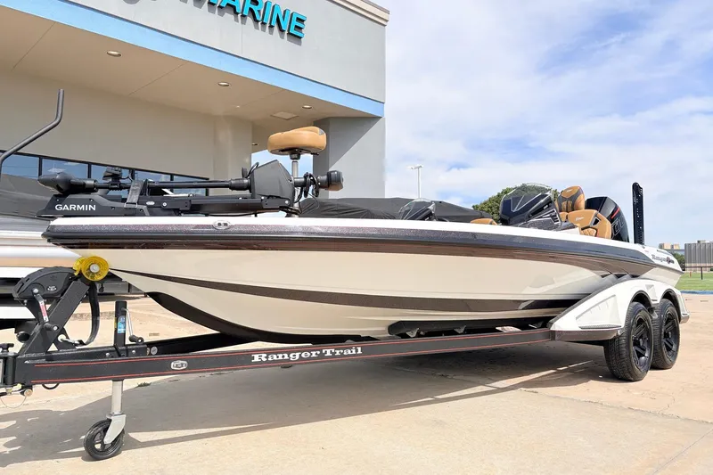 Slide: The Image of 2026 Ranger Z521R Ultra boat on trailer outside marine dealership. - 3