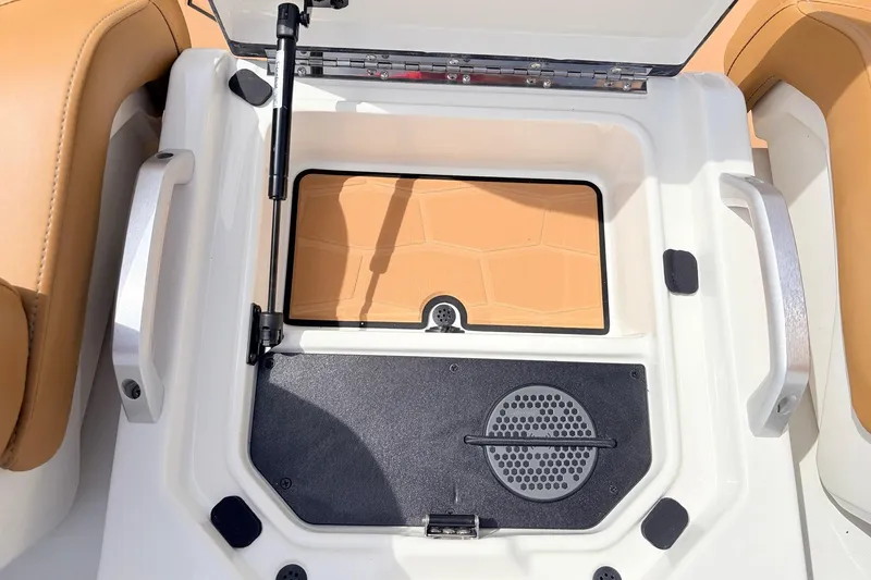 Slide: The Image of 2026 Ranger Z521R Ultra boat storage compartment with tan and black interior details. - 46