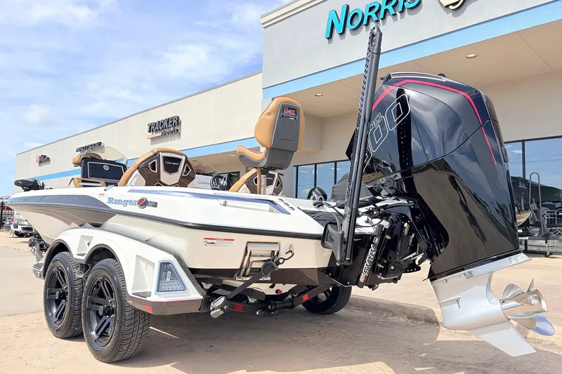 Slide: The Image of 2026 Ranger Z521R Ultra boat with powerful engine, parked outside dealership. - 9