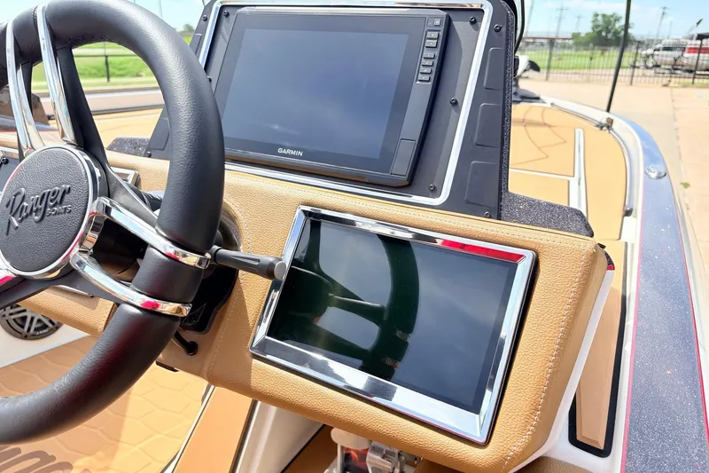 Slide: The Image of Dashboard of 2026 Ranger Z521R Ultra boat with steering wheel and dual displays. - 41