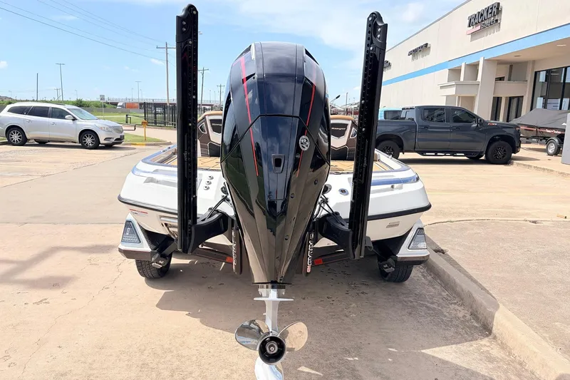 Slide: The Image of 2026 Ranger Z521R Ultra boat with powerful outboard motor, parked outside dealership. - 8