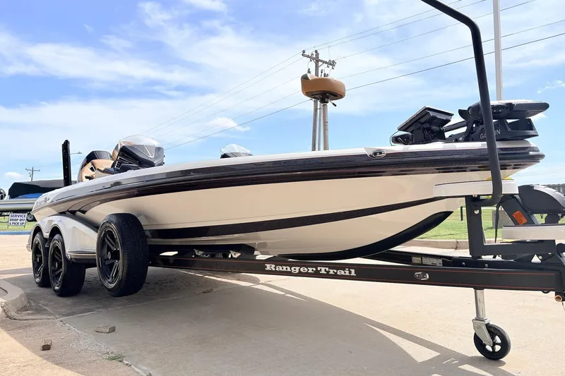 Slide: The Image of 2026 Ranger Z521R Ultra boat on trailer under clear blue sky. - 5