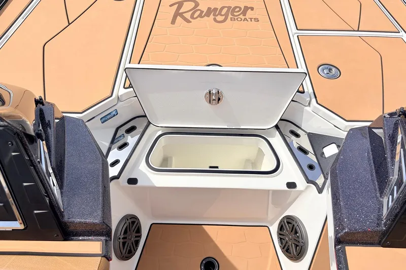 Slide: The Image of 2026 Ranger Z521R Ultra boat deck with open storage compartment and sleek design. - 30