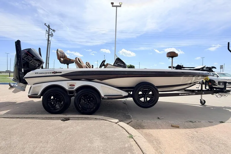 Slide: The Image of 2026 Ranger Z521R Ultra boat on trailer, parked outdoors under blue sky. - 6