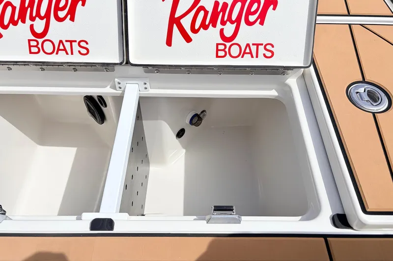 Slide: The Image of Open storage compartment on 2026 Ranger Z521R Ultra boat with Ranger Boats branding. - 51