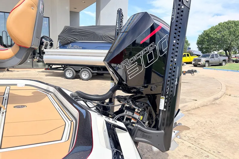 Slide: The Image of 2026 Ranger Z521R Ultra boat with powerful Racing 300 engine, parked outdoors. - 10