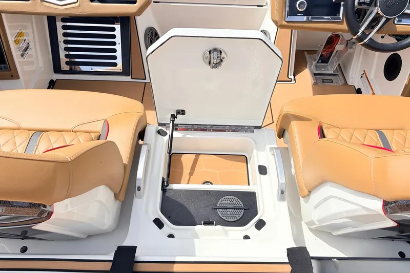 Slide: The Image of 2026 Ranger Z521R Ultra boat interior with tan seats and storage compartment. - 45