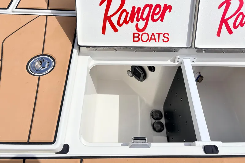 Slide: The Image of 2026 Ranger Z521R Ultra boat storage compartment with Ranger Boats branding. - 50