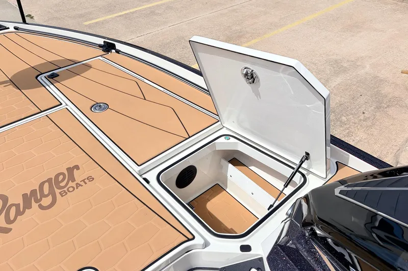 Slide: The Image of 2026 Ranger Z521R Ultra boat deck with open storage compartment. - 27