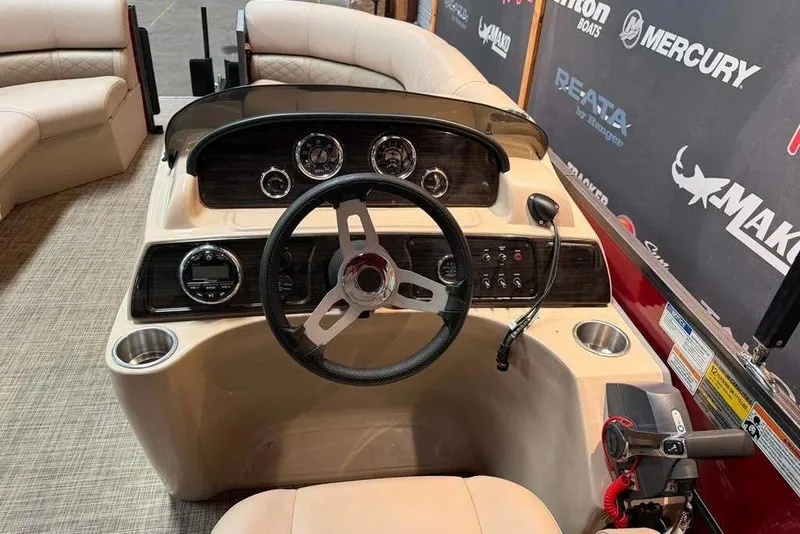 Slide: The Image of 2020 Misty Harbor 2285RSF boat dashboard with steering wheel and controls. - 7