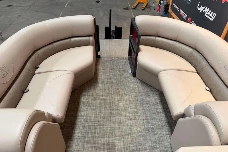 Slide: The Image of Luxurious seating on a 2020 Misty Harbor 2285RSF pontoon boat, featuring beige upholstery. - 5