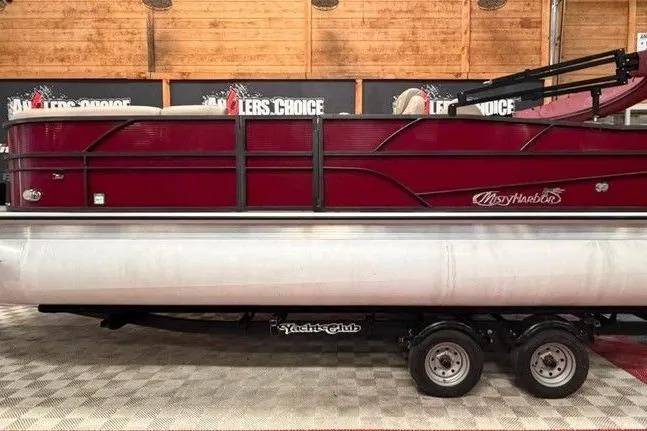 The Image of 2020 Misty Harbor 2285RSF pontoon boat in showroom, red exterior, on trailer. - 1