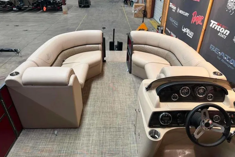 Slide: The Image of 2020 Misty Harbor 2285RSF pontoon boat interior with plush seating and modern dashboard. - 6