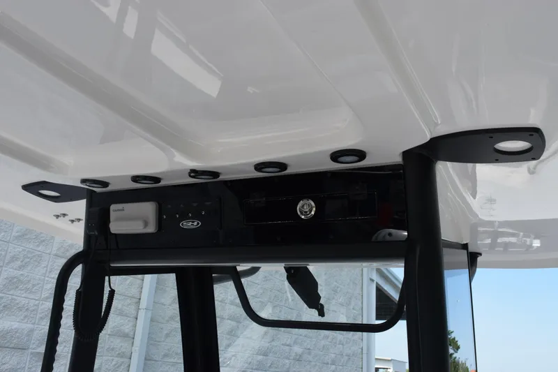 Slide: The Image of 2027 Sea Hunt Gamefish 28 Forward Seating boat console with electronics and lighting. - 10