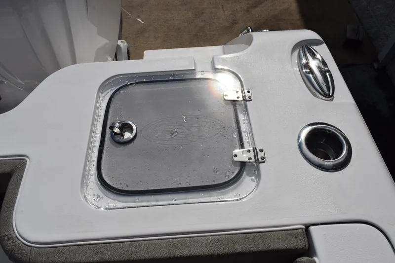 Slide: The Image of 2027 Sea Hunt Gamefish 28 boat deck with storage hatch and cup holders. - 18