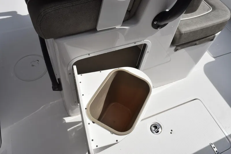 Slide: The Image of 2027 Sea Hunt Gamefish 28 Forward Seating storage compartment with open hatch and seating detail. - 17