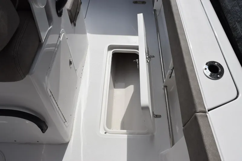 Slide: The Image of 2027 Sea Hunt Gamefish 28 Forward Seating boat storage compartment open on deck. - 22
