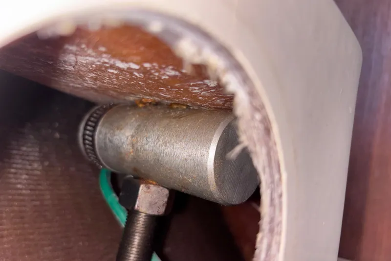 Slide: The Image of Close-up of a metal component inside a 1989 CAL 33 boat. - 35