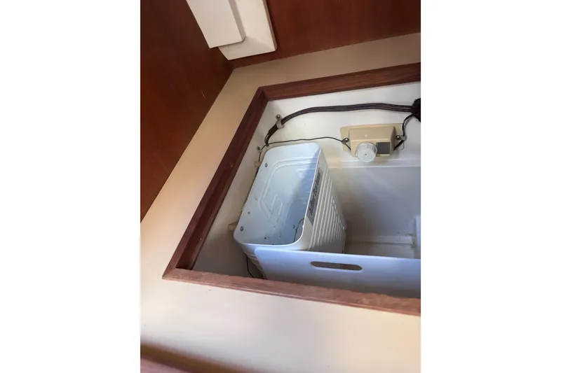 Slide: The Image of Built-in appliance in a 1989 CAL 33 boat interior compartment. - 30