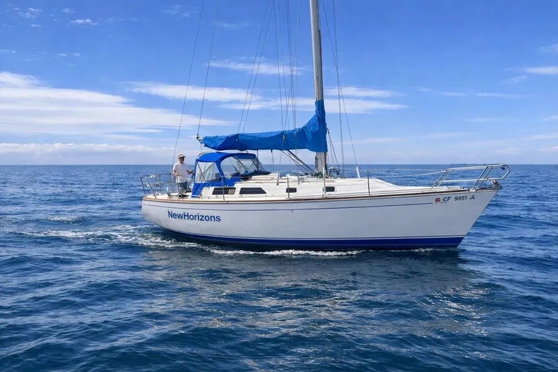The Image of Sailboat "NewHorizons" on open sea, CAL 33 model, 1989, with blue sail cover. - 0